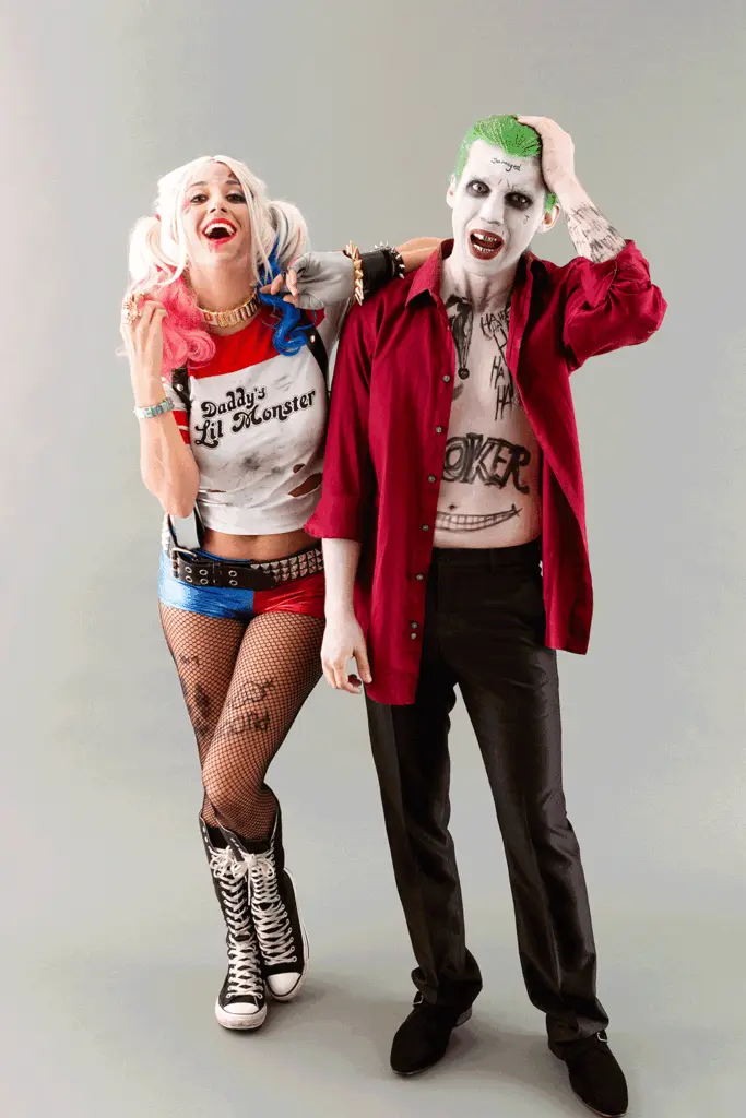 Couple dressed as Joker and Harley Quinn in matching Halloween costumes &mdash; fun, iconic, and easy DIY cosplay idea for couples.