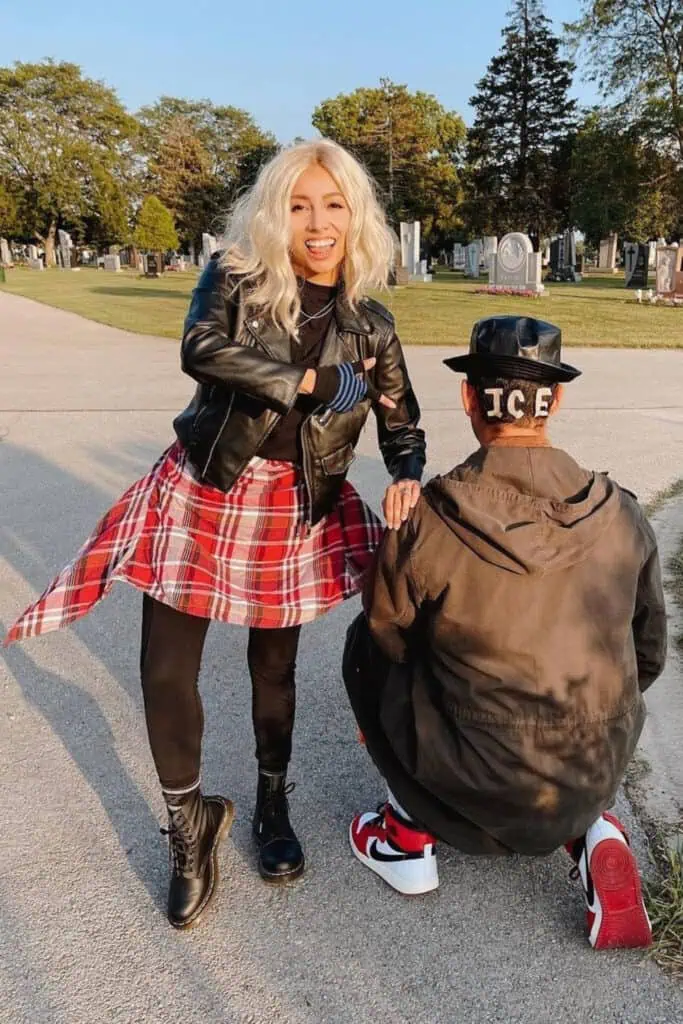 Funny couples Halloween costume inspired by the Hocus Pocus bullies Ice and Jay, with a leather jacket, plaid shirt, wig, and the iconic ICE hat.
